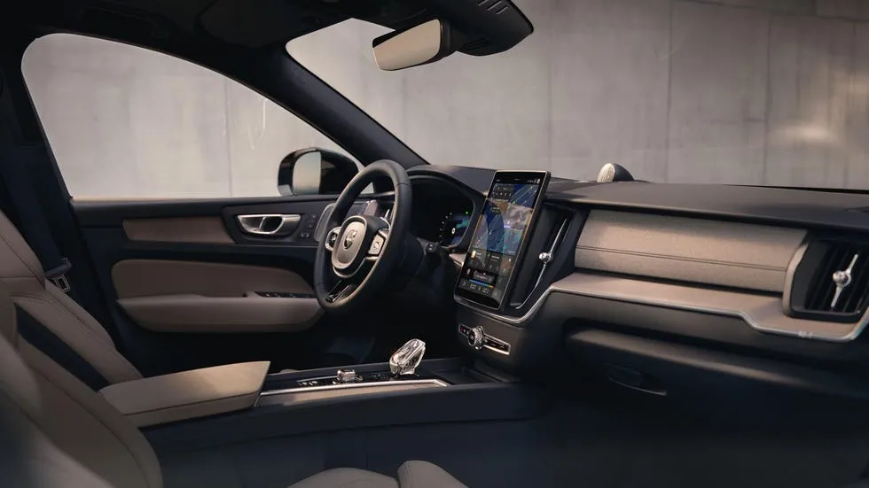 Interior of a modern car featuring a sleek dashboard, touchscreen display, and comfortable seating.