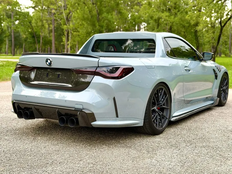 Вид сбоку на уникальный грузовой BMW M4 от ателье DinMann